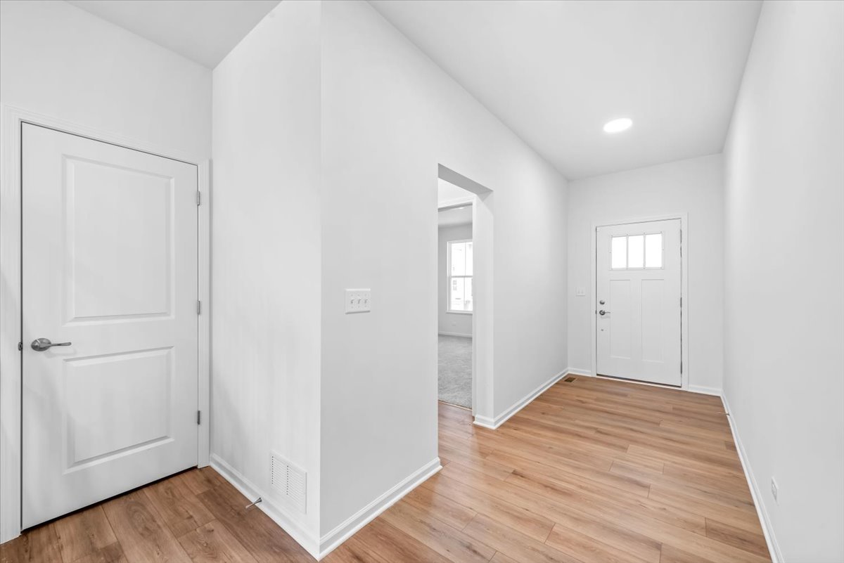 102 Hedgerow Drive Elgin, IL 60124 - Photo 10 of 48 a view of a hallway with wooden floor