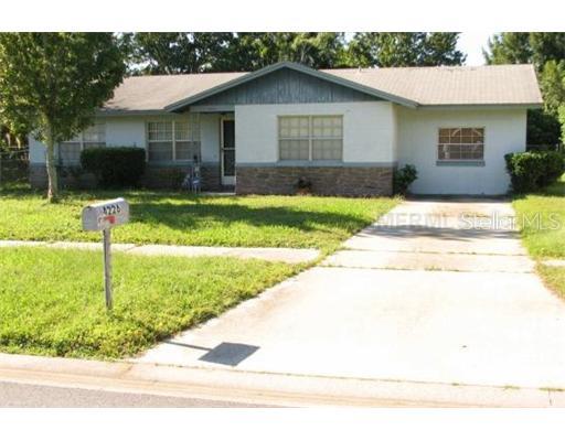 4226 Chateau Road Orlando, FL 32808 - Photo 1 of 1 a backyard of a house with lots of green space