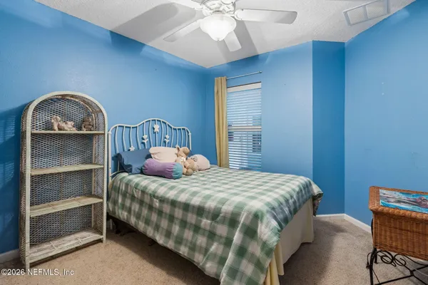 a kitchen with stainless steel appliances granite countertop a refrigerator a stove and a sink