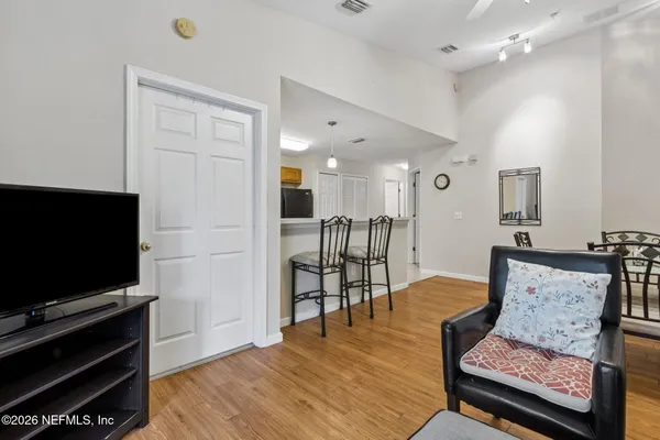 a view of a dining room with furniture and wooden floor