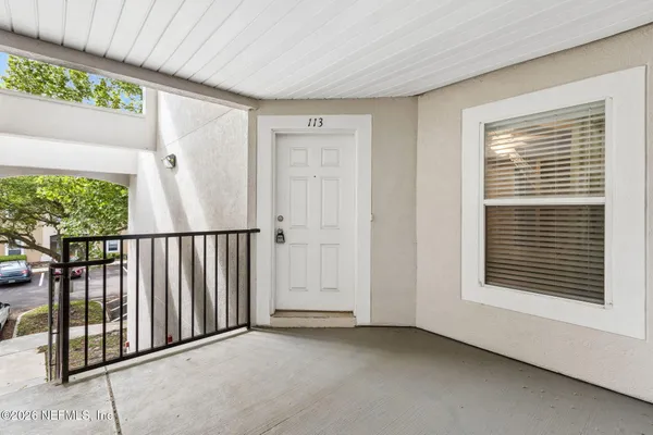 a bed room with a bed and a chandelier