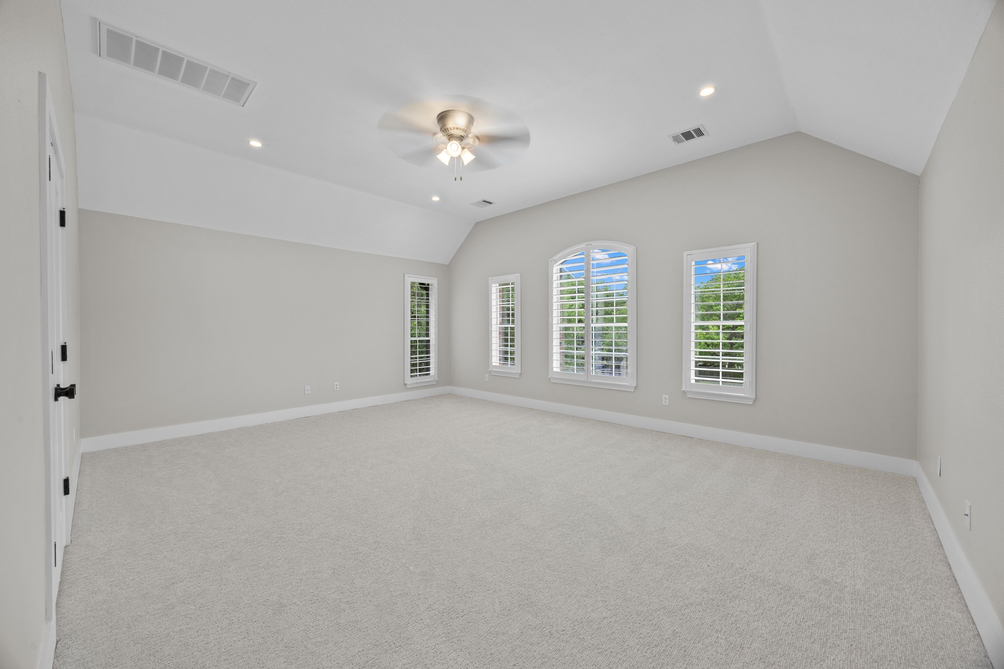 6900 Magenta Lane Austin, TX 78739 - Photo 27 of 40 an empty room with chandelier fan and windows