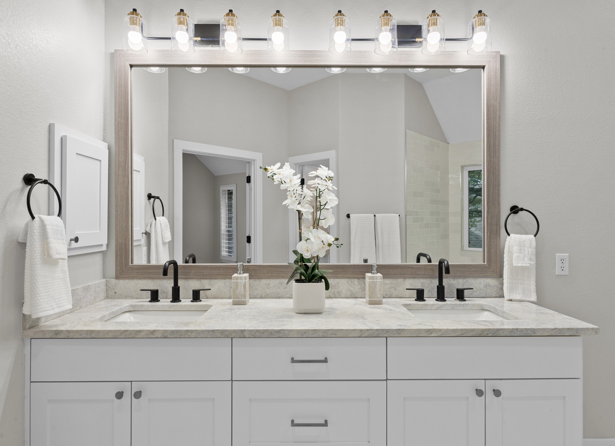 6900 Magenta Lane Austin, TX 78739 - Photo 30 of 40 a bathroom with vanity sink and mirror