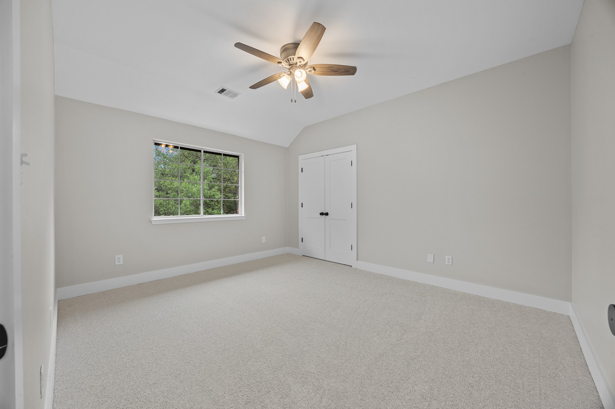 6900 Magenta Lane Austin, TX 78739 - Photo 34 of 40 an empty room with windows and fan