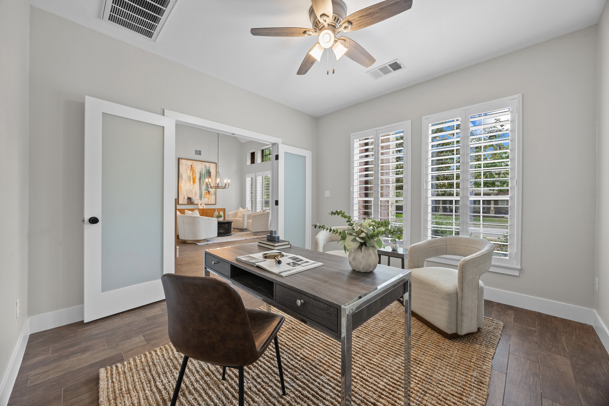 6900 Magenta Lane Austin, TX 78739 - Photo 6 of 40 a dining room with wooden floor and a chandelier