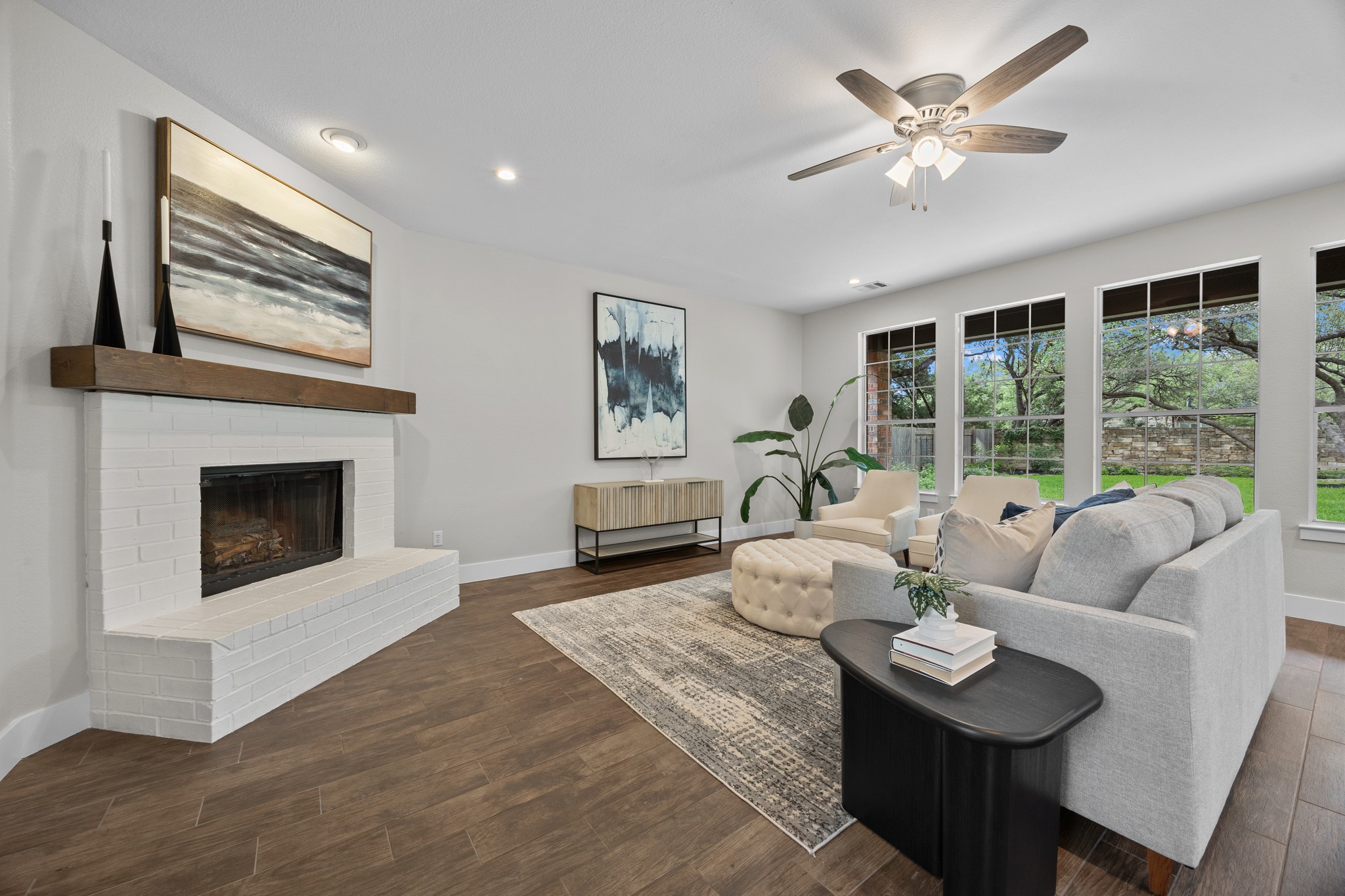 6900 Magenta Lane Austin, TX 78739 - Photo 7 of 40 a living room with furniture and a fireplace
