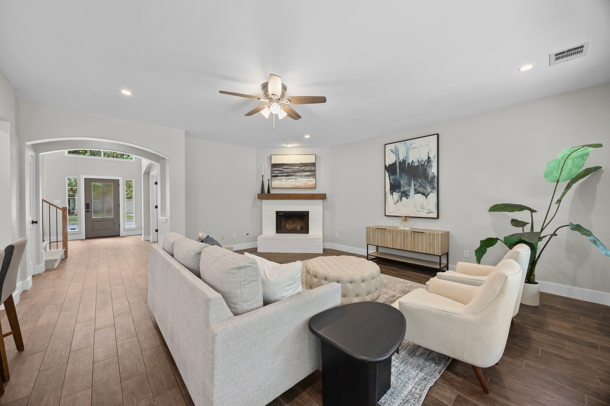 6900 Magenta Lane Austin, TX 78739 - Photo 10 of 40 a living room with furniture a fireplace and wooden floor