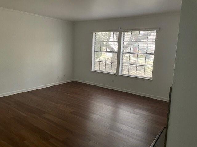 4748 Old Bent Tree Lane, Unit 1905 Dallas, TX 75287 - Photo 17 of 18 an empty room with wooden floor and windows