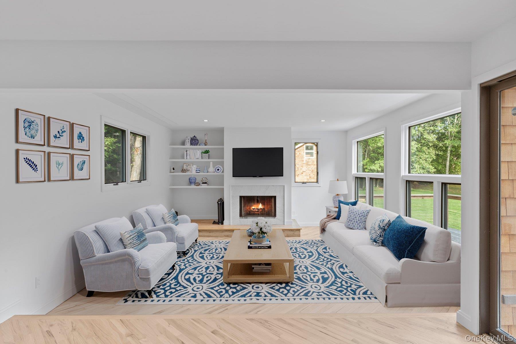 3630 Soundview Avenue Peconic, NY 11958 - Photo 12 of 44 a living room with furniture fireplace and window