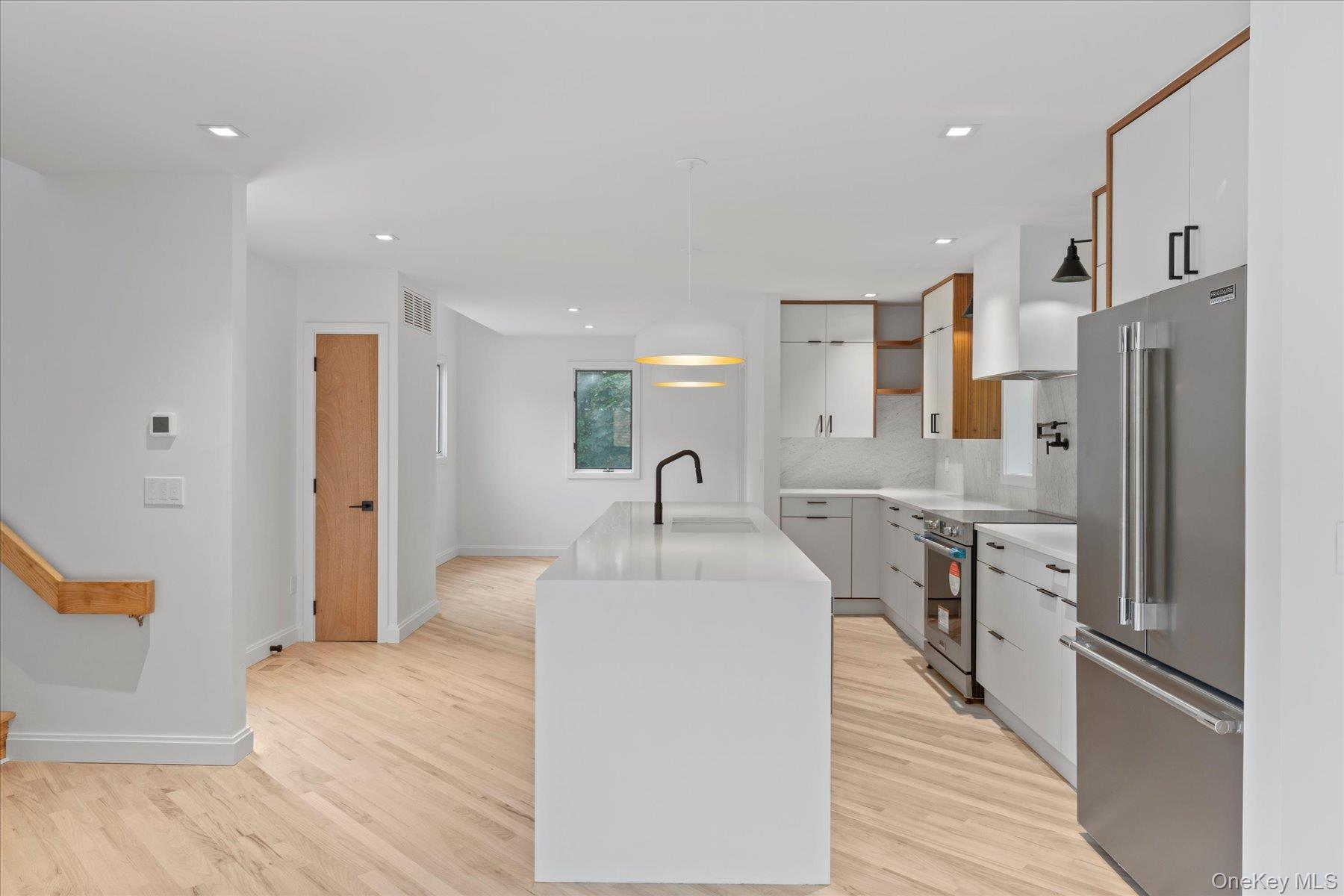 3630 Soundview Avenue Peconic, NY 11958 - Photo 14 of 44 a large white kitchen with stainless steel appliances