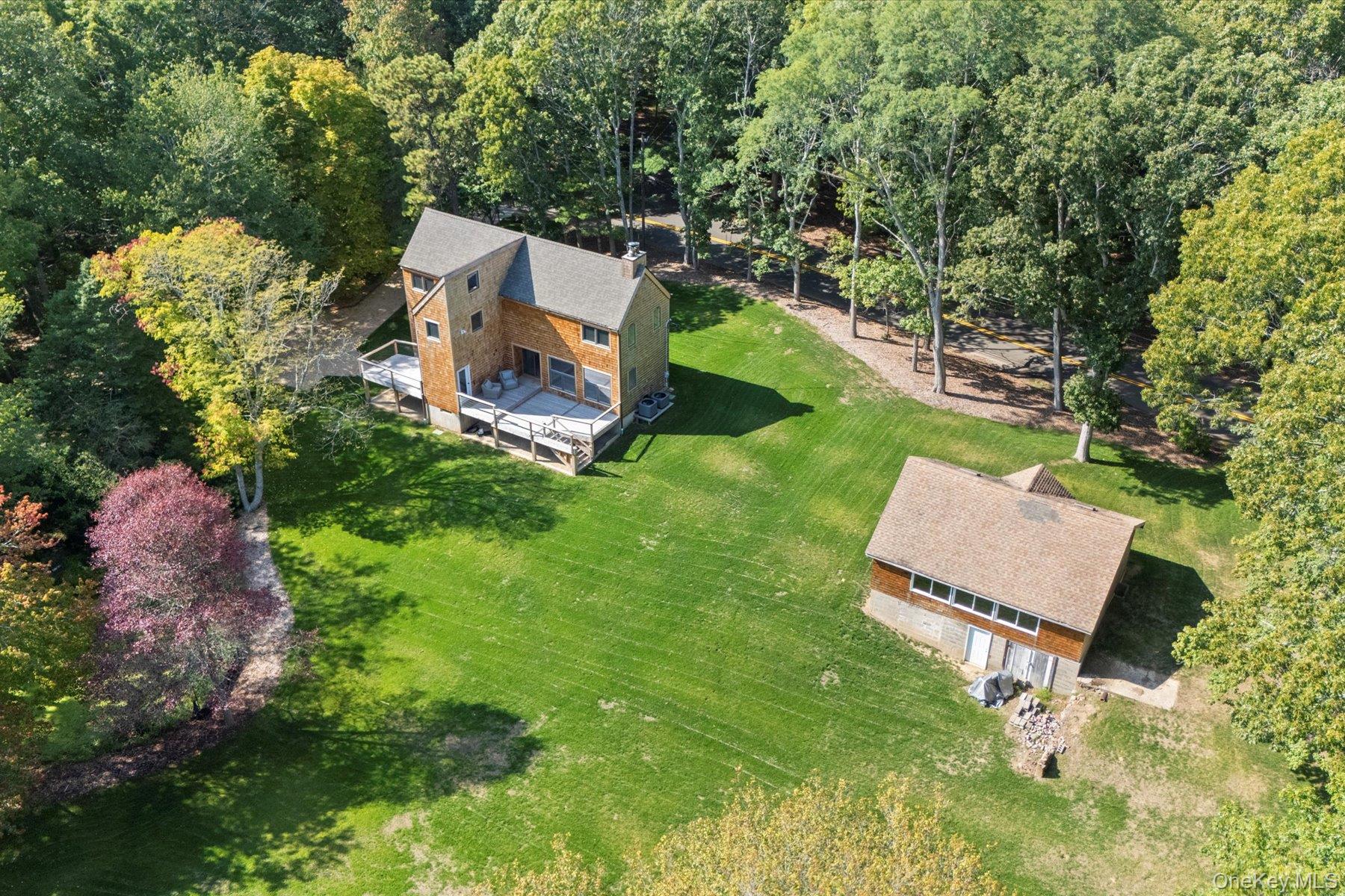 3630 Soundview Avenue Peconic, NY 11958 - Photo 27 of 44 an aerial view of a house with a yard and lake