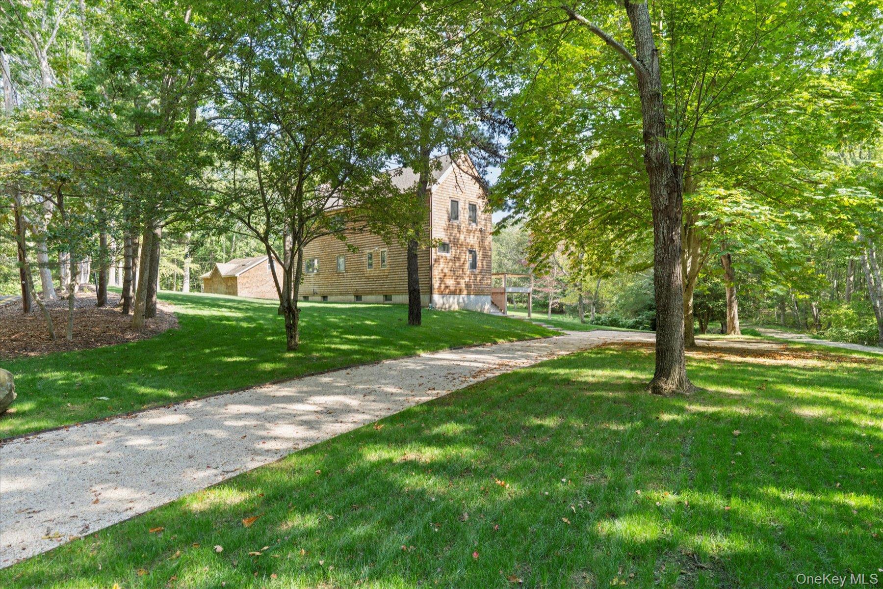 3630 Soundview Avenue Peconic, NY 11958 - Photo 3 of 44 a view of a park with a tree