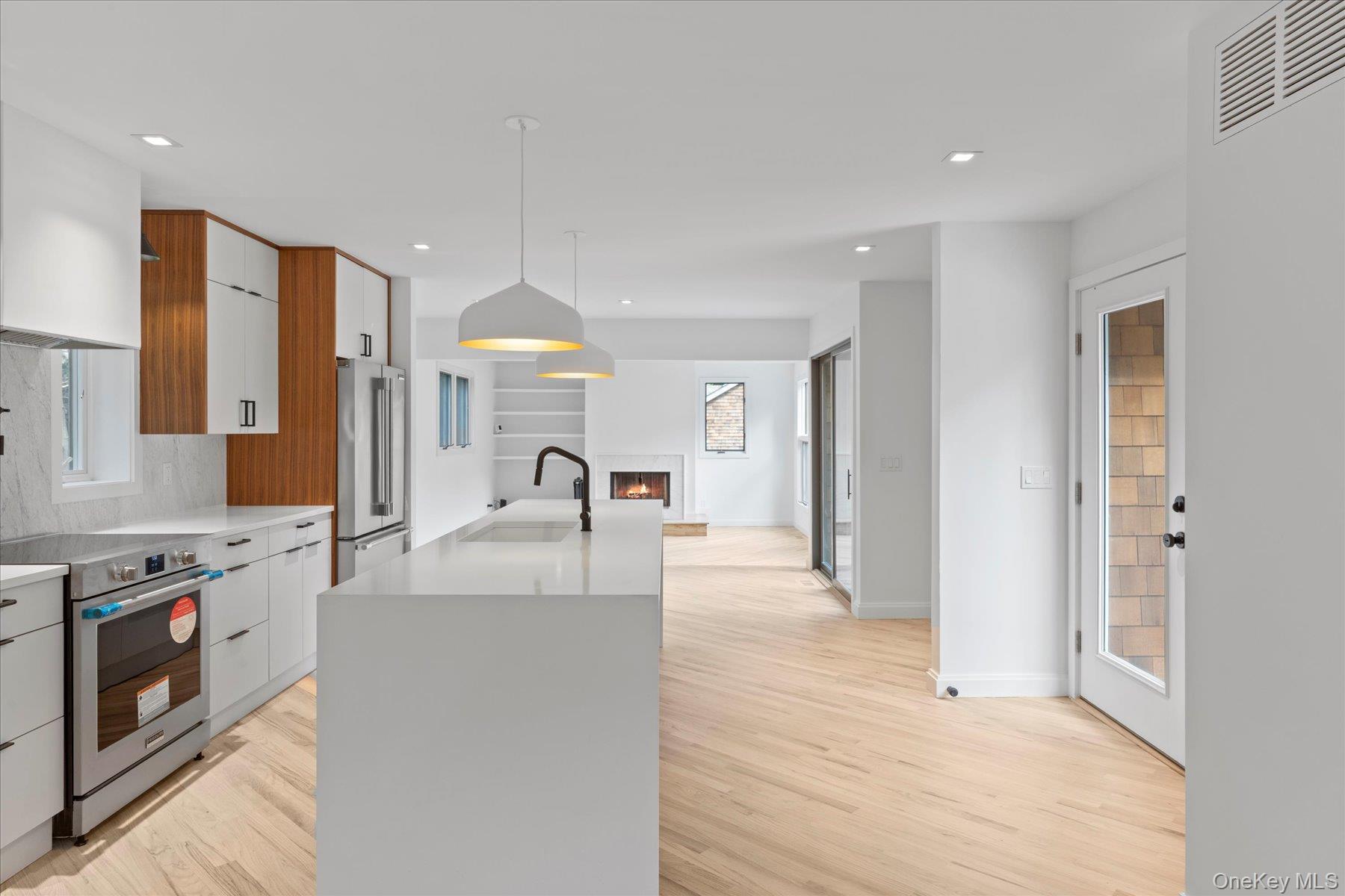 3630 Soundview Avenue Peconic, NY 11958 - Photo 4 of 44 a view of a kitchen with kitchen island a sink stainless steel appliances and cabinets