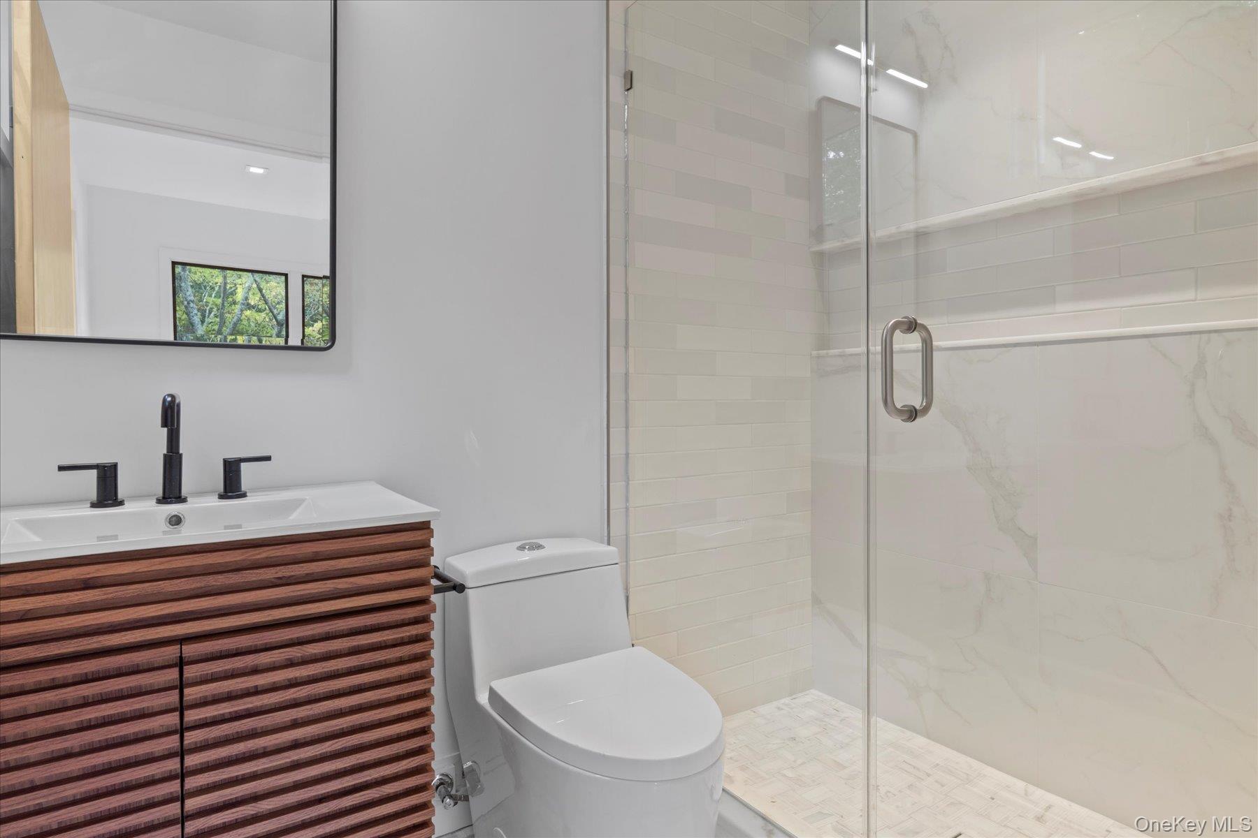 3630 Soundview Avenue Peconic, NY 11958 - Photo 6 of 44 a bathroom with a sink toilet and shower