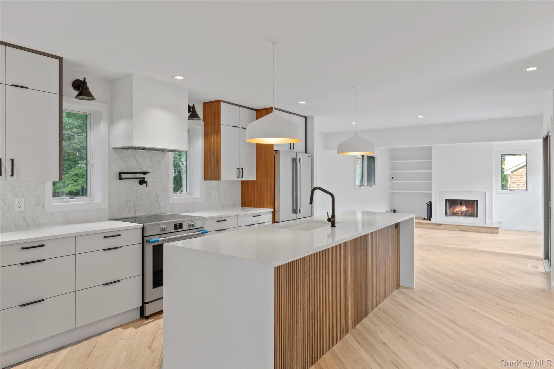 3630 Soundview Avenue Peconic, NY 11958 - Photo 8 of 44 a kitchen with stainless steel appliances granite countertop a sink stove and cabinets