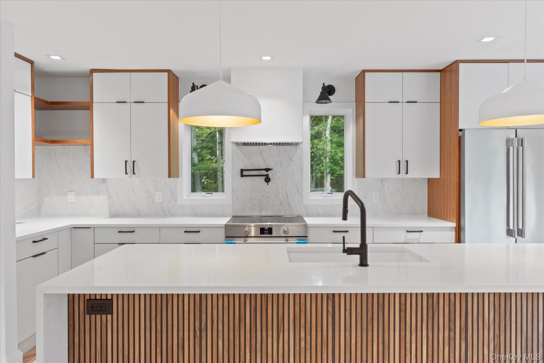 3630 Soundview Avenue Peconic, NY 11958 - Photo 9 of 44 a bathroom with a sink a mirror and a shower