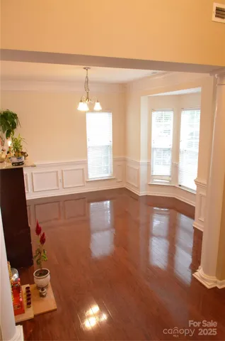 a view of livingroom with furniture wooden floor and windows