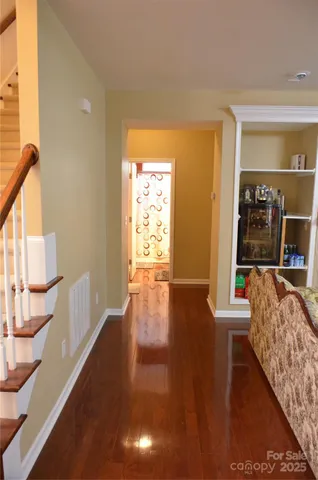 a view of living room with furniture and wooden floor