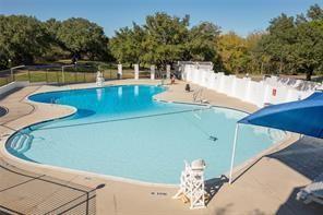 8419 West Landings Road Granbury, TX 76049 - Photo 21 of 39 a view of a swimming pool with a patio