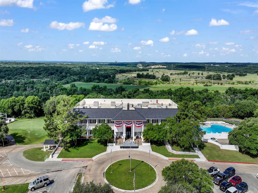 8419 West Landings Road Granbury, TX 76049 - Photo 27 of 39 a aerial view of a house with a yard and a garden