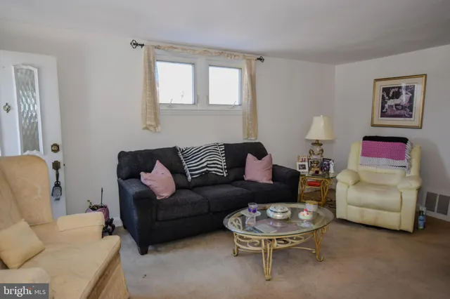 a living room with furniture and a couch