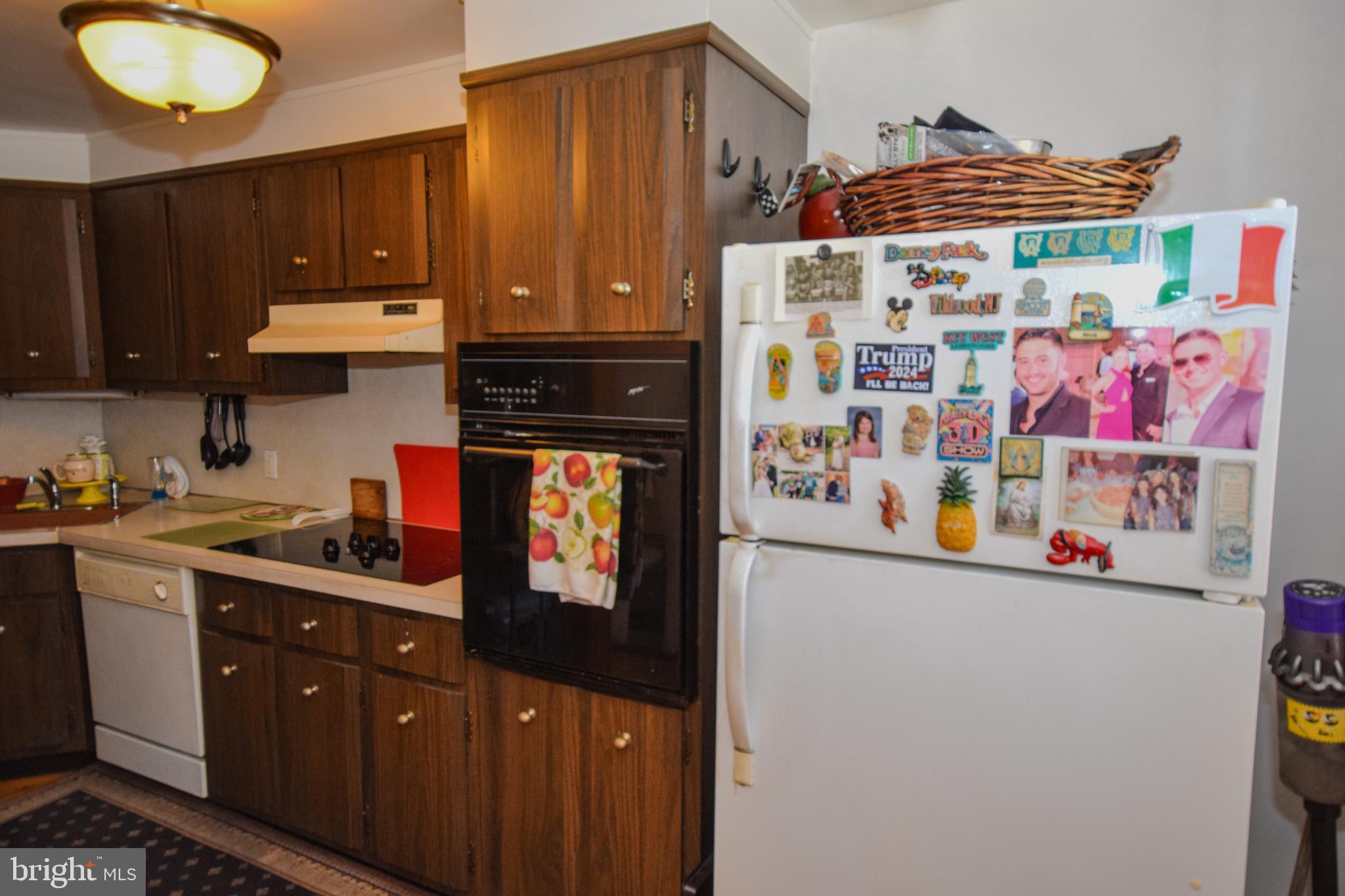 853 Gainsboro Road Drexel Hill, PA 19026 - Photo 23 of 43 a kitchen with stainless steel appliances granite countertop a refrigerator and a stove top oven