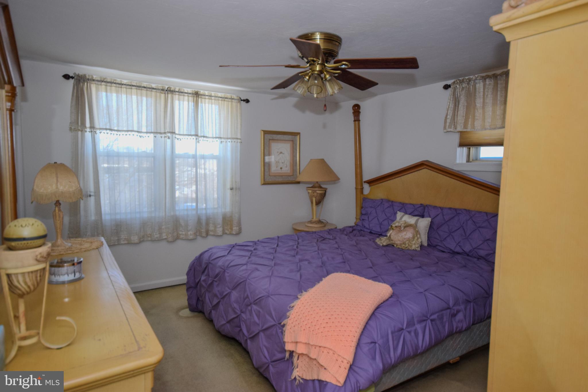 853 Gainsboro Road Drexel Hill, PA 19026 - Photo 25 of 43 a bedroom with a large bed and a chandelier