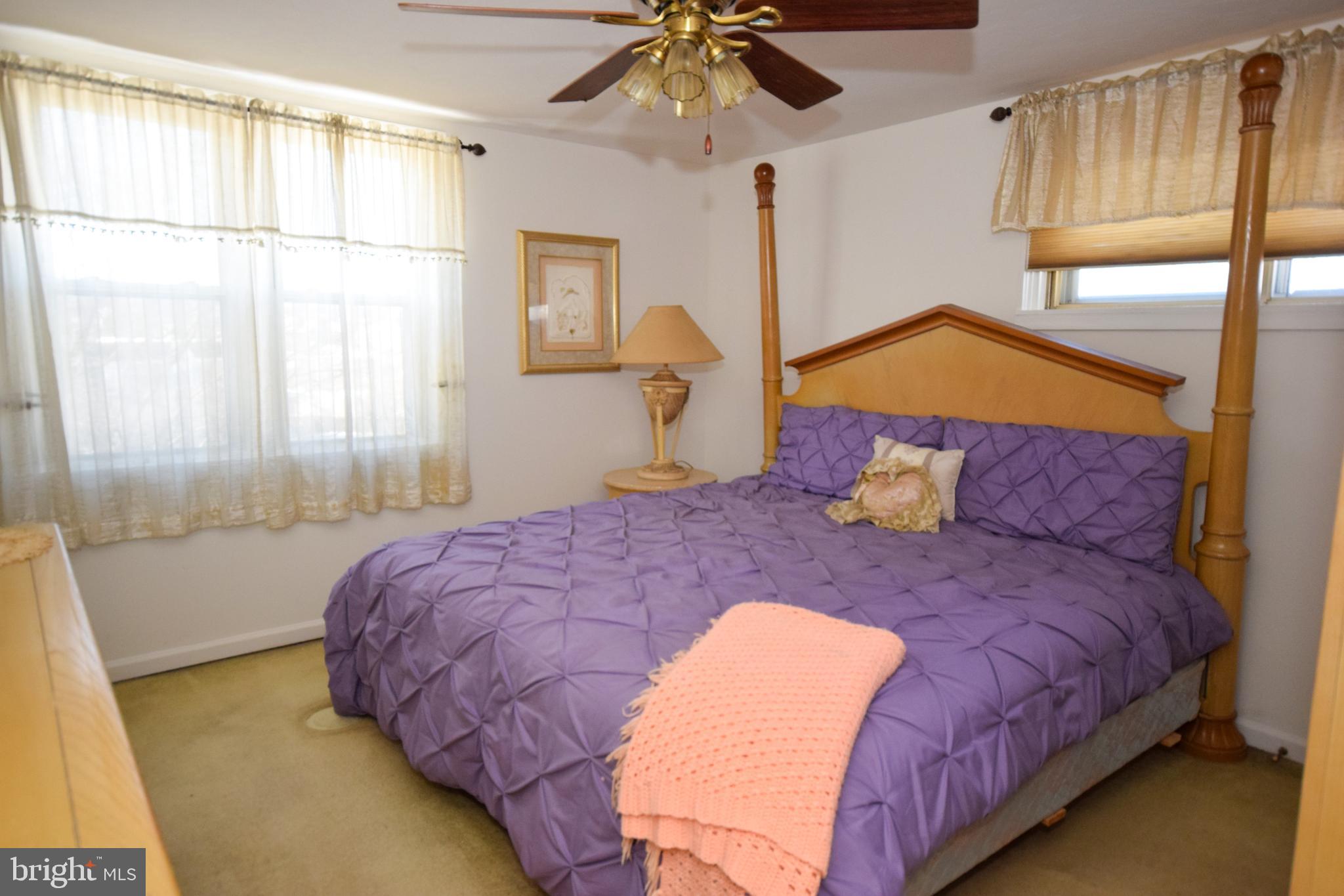853 Gainsboro Road Drexel Hill, PA 19026 - Photo 26 of 43 a bedroom with a bed and a chandelier