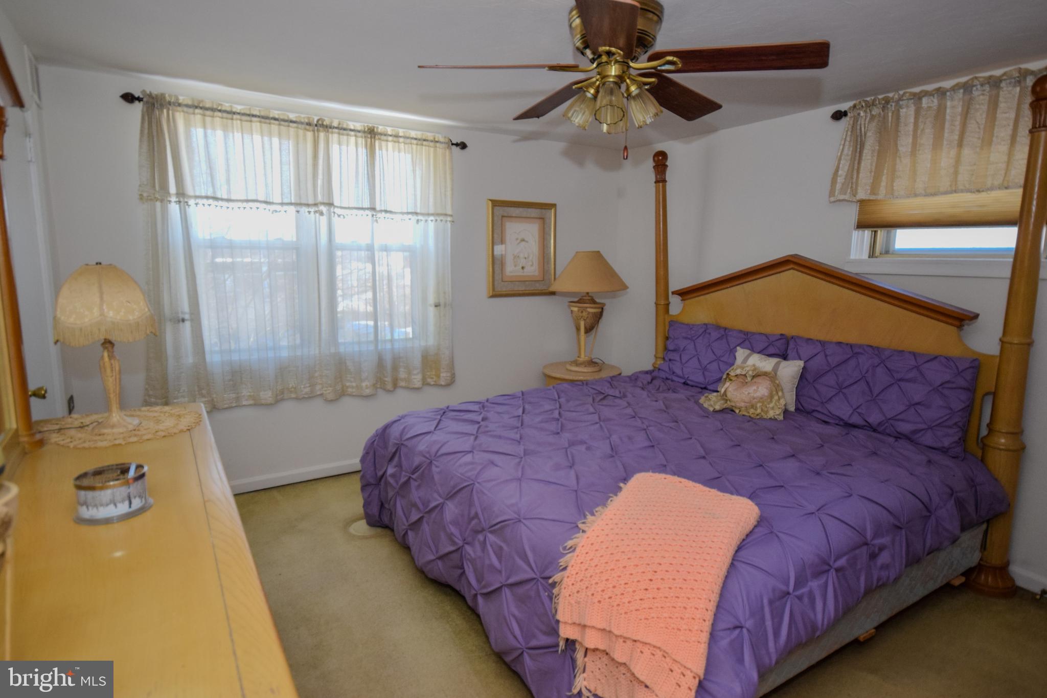 853 Gainsboro Road Drexel Hill, PA 19026 - Photo 27 of 43 a bedroom with a bed a chandelier and a window