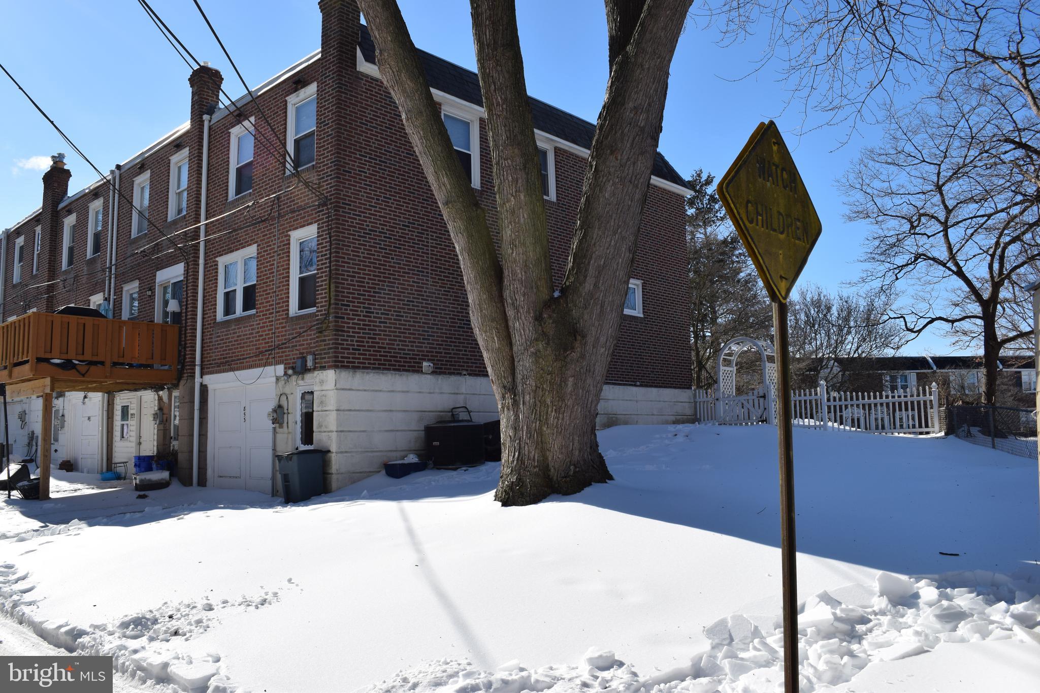 853 Gainsboro Road Drexel Hill, PA 19026 - Photo 10 of 43 a view of a building with a tree