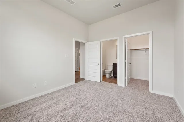 a view of a kitchen with microwave and cabinets