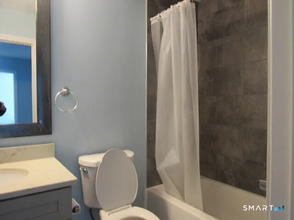 a bathroom with a toilet and a sink