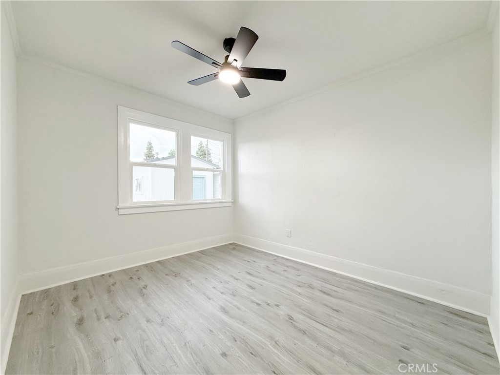 2222 East 124th Street Compton, CA 90222 - Photo 18 of 20 wooden floor in an empty room with a window