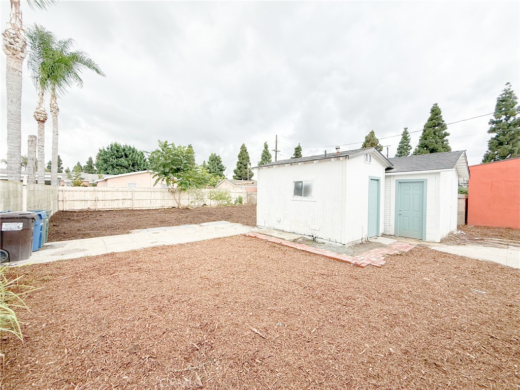 2222 East 124th Street Compton, CA 90222 - Photo 19 of 20 a view of a house with a yard and plant