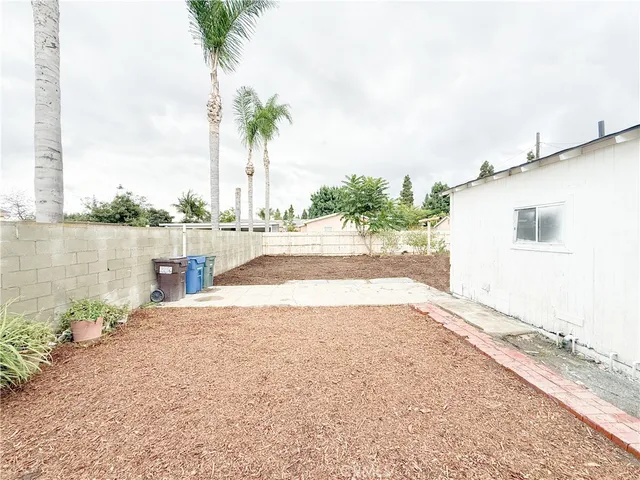 a view of a house with a yard and ocean view