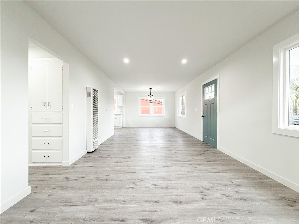 2222 East 124th Street Compton, CA 90222 - Photo 10 of 20 wooden floor in an empty room with a window