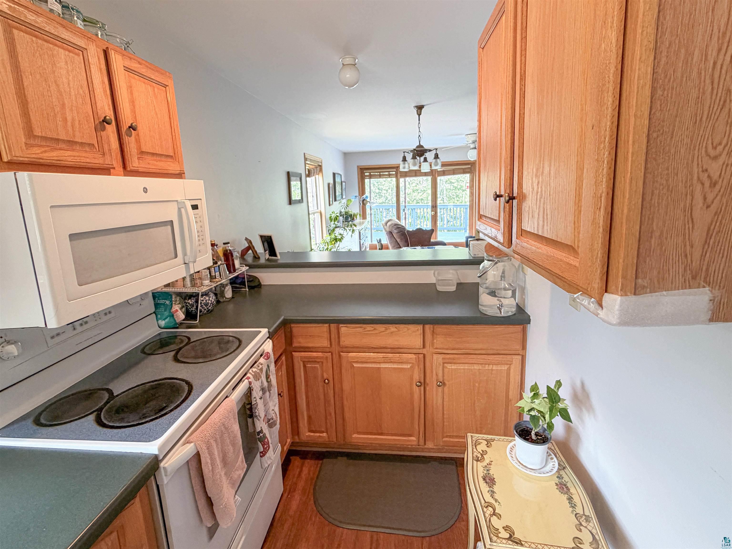 Wood-finish cabinetry paired with dark countertops