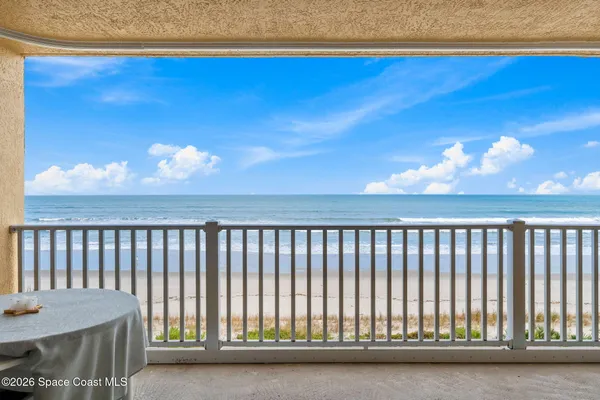 a view of balcony with furniture