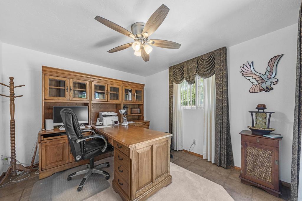 30265 Miller Road Valley Center, CA 92082 - Photo 17 of 56 a view of a workspace with furniture and a window