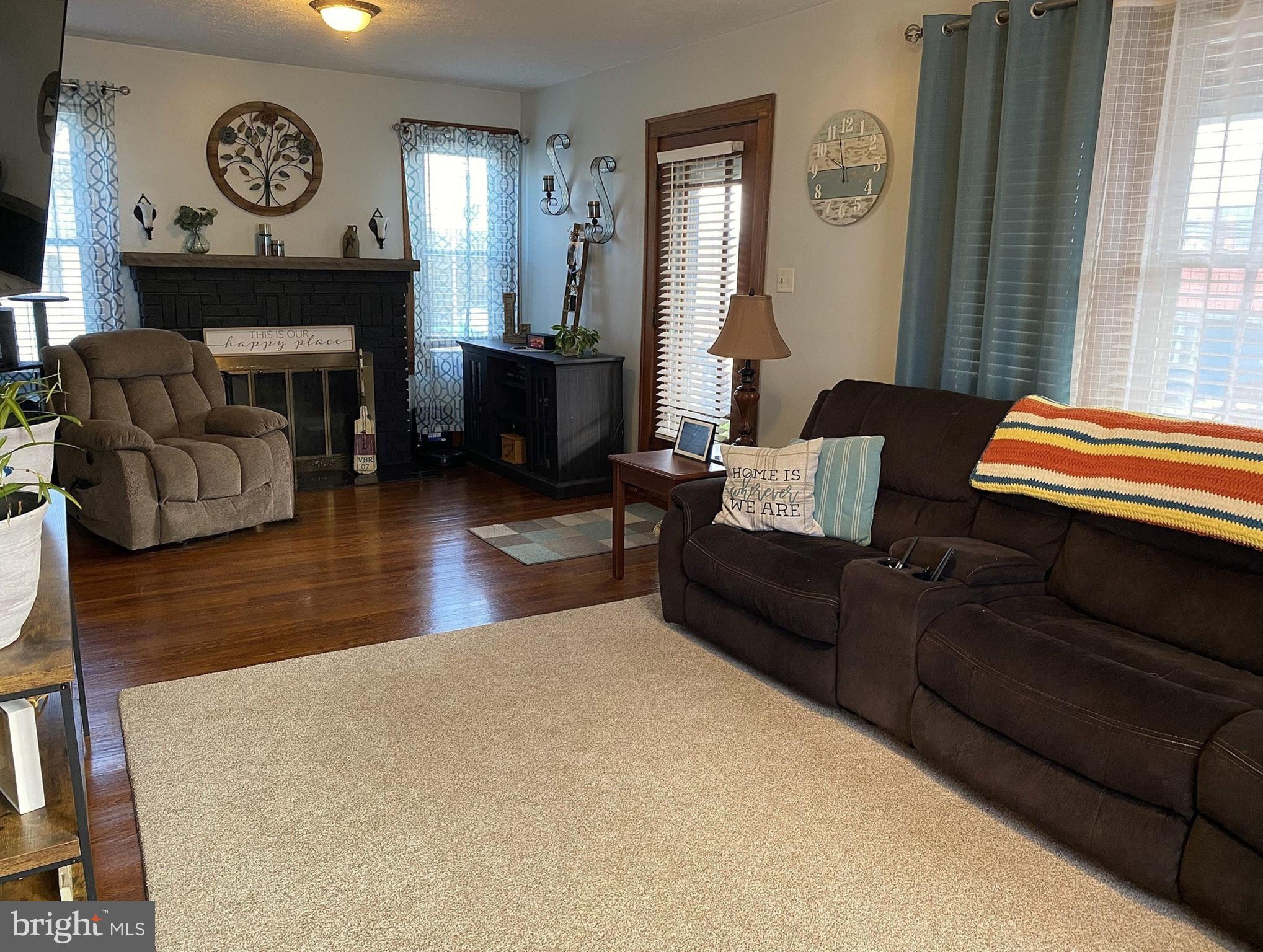 14103 Temple Street Ellerslie, MD 21529 - Photo 12 of 57 a living room with furniture and a fireplace