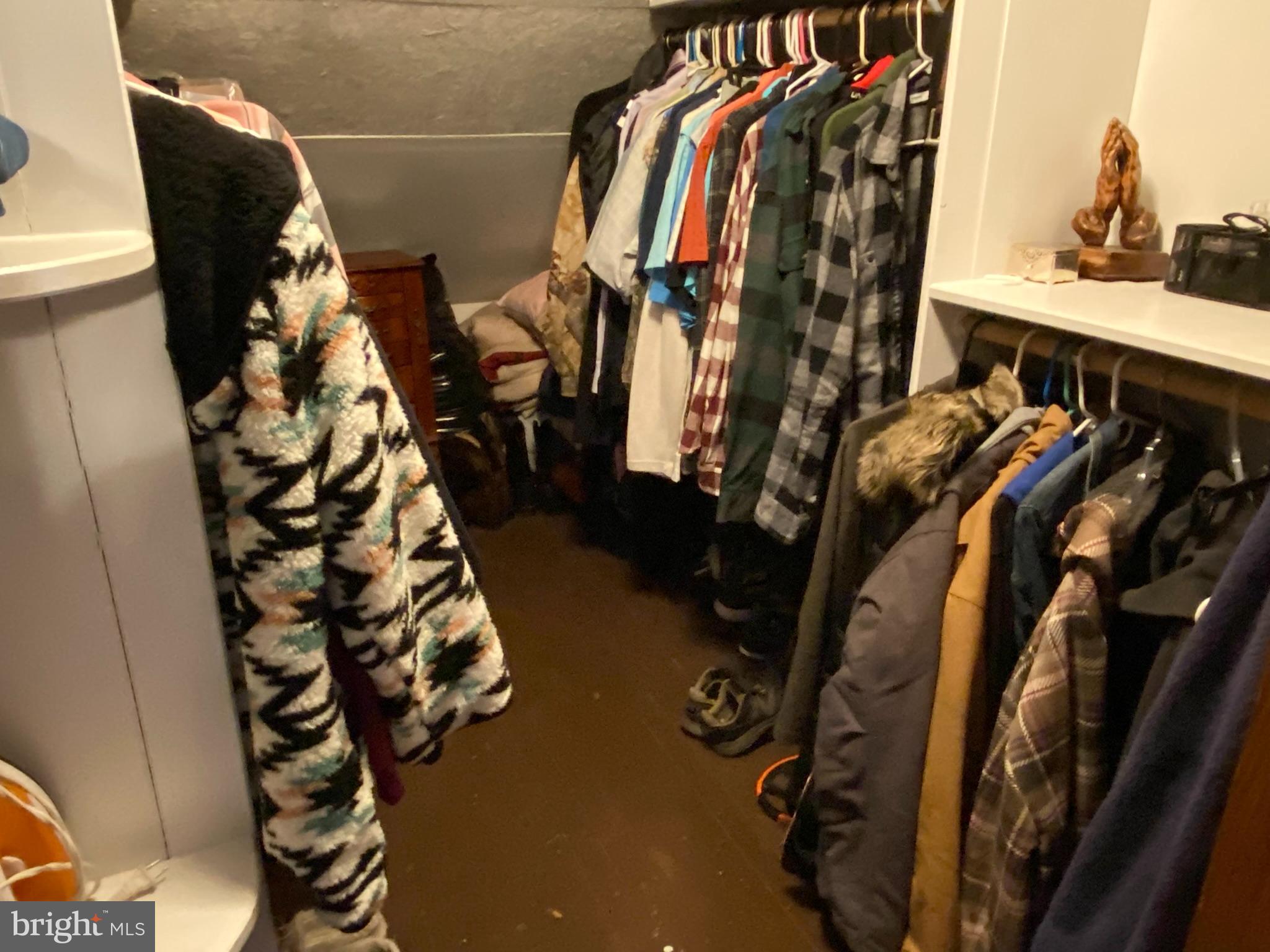 14103 Temple Street Ellerslie, MD 21529 - Photo 24 of 57 a view of walk in closet with clothes and shoes