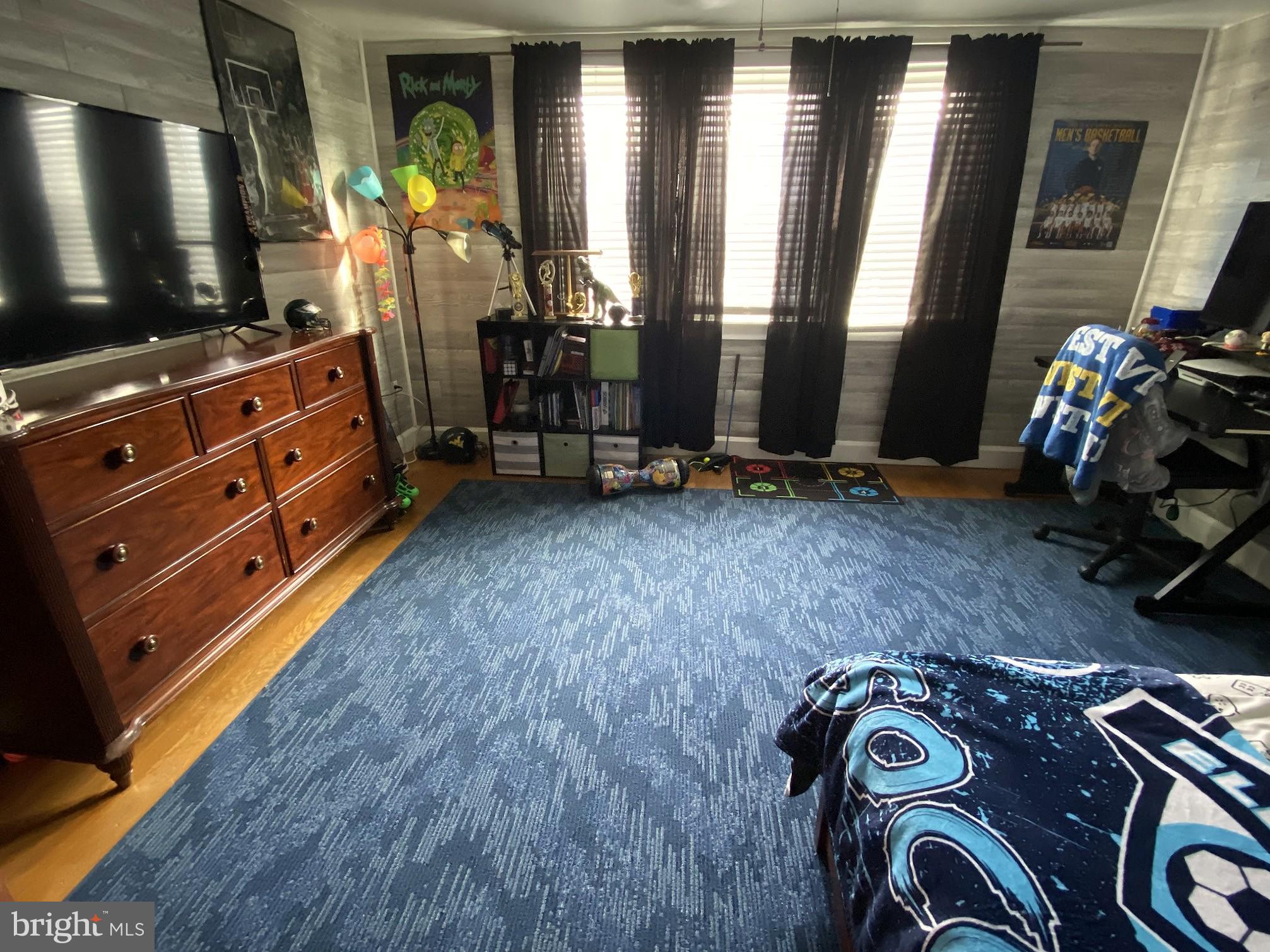 14103 Temple Street Ellerslie, MD 21529 - Photo 25 of 57 a room with gym equipment and a flat screen tv