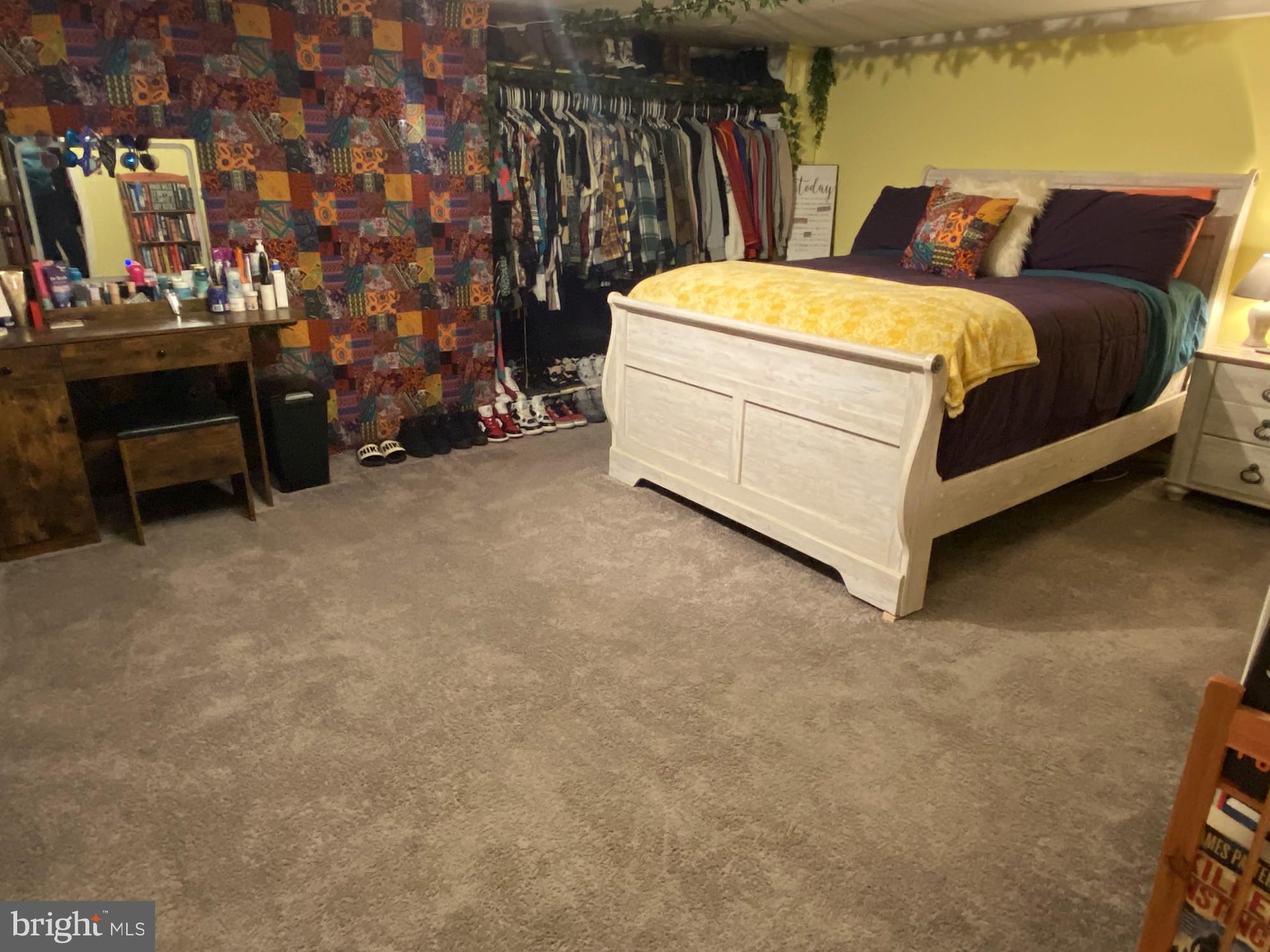 14103 Temple Street Ellerslie, MD 21529 - Photo 36 of 57 a bed room with a bed and a chair