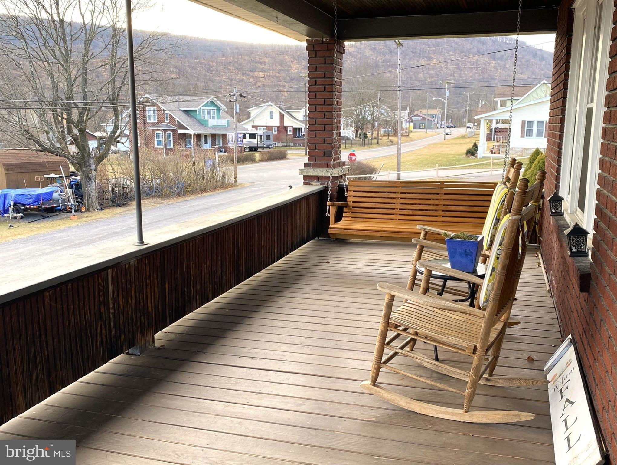 14103 Temple Street Ellerslie, MD 21529 - Photo 43 of 57 a view of a balcony with wooden floor and outdoor seating