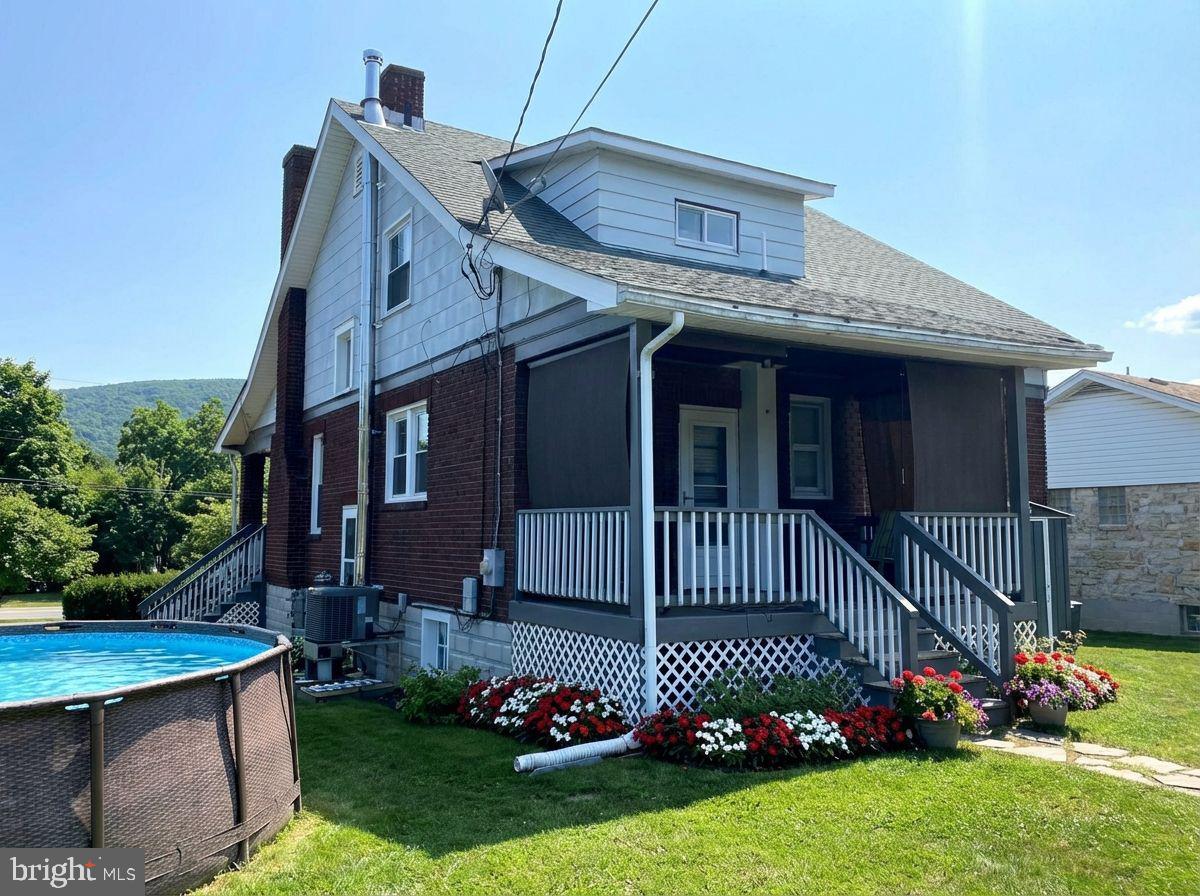 14103 Temple Street Ellerslie, MD 21529 - Photo 50 of 57 a front view of a house with a garden