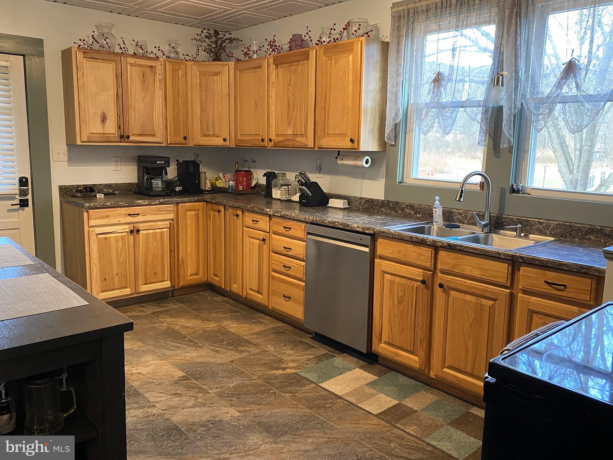 14103 Temple Street Ellerslie, MD 21529 - Photo 6 of 57 a kitchen with stainless steel appliances granite countertop a sink a stove a counter space and cabinets