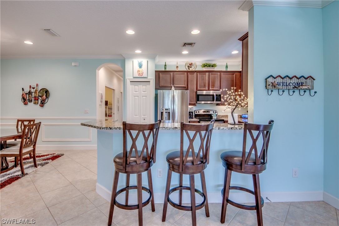 10420 Peso Del Rio Drive Fort Myers, FL 33908 - Photo 12 of 50 a view of a dining room with furniture