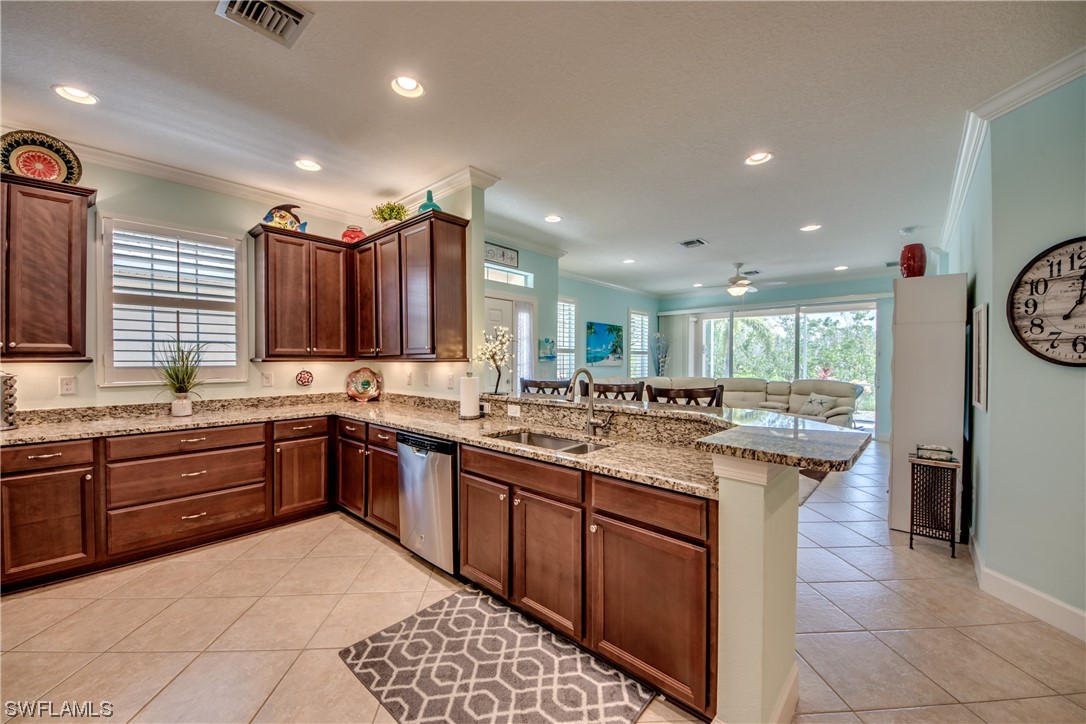 10420 Peso Del Rio Drive Fort Myers, FL 33908 - Photo 19 of 50 a kitchen with a sink stove and cabinets
