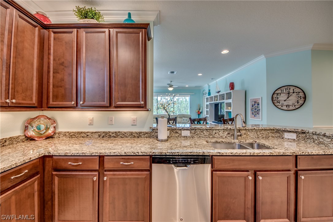 10420 Peso Del Rio Drive Fort Myers, FL 33908 - Photo 21 of 50 a bathroom with a granite countertop sink and a wooden floor