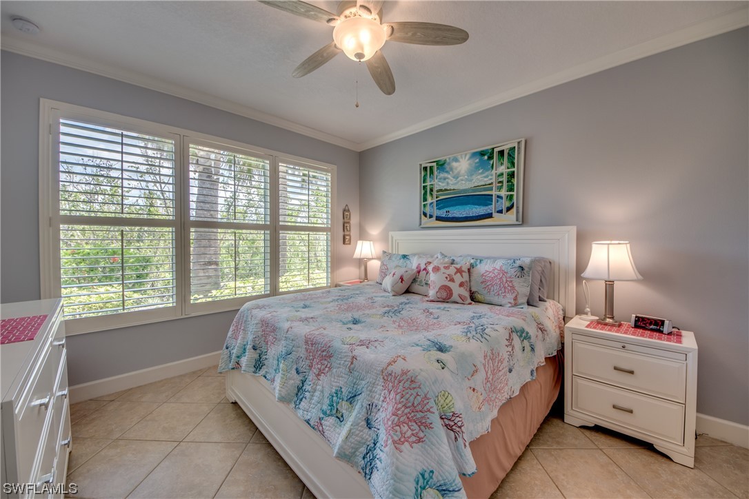 10420 Peso Del Rio Drive Fort Myers, FL 33908 - Photo 24 of 50 a bedroom with a bed and a window